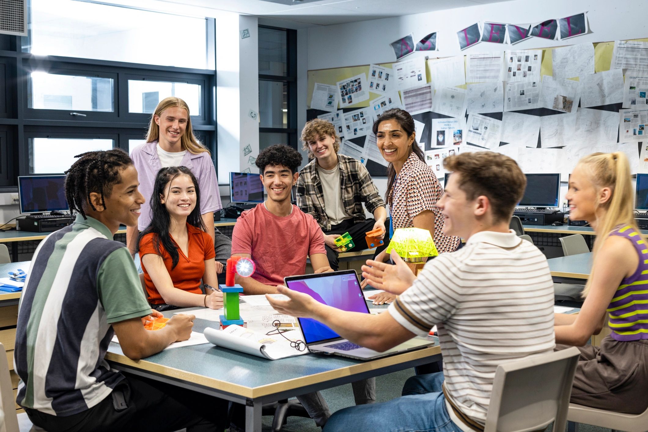 Students and teacher collaborating in a classroom